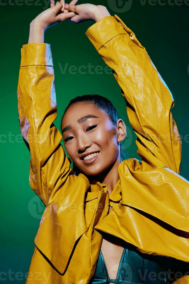 Woman trendy yellow green make-up night light neon beauty disco colorful body fashion photo