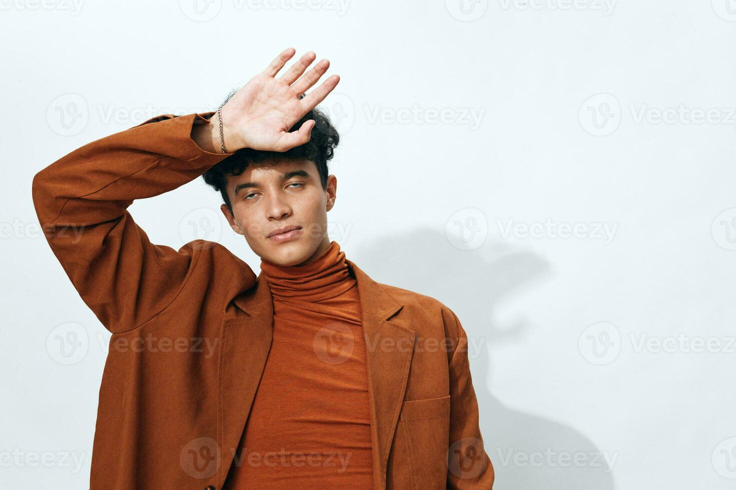 One man curly fashion lifestyle portrait casual trendy beautiful beige modern student clothes photo