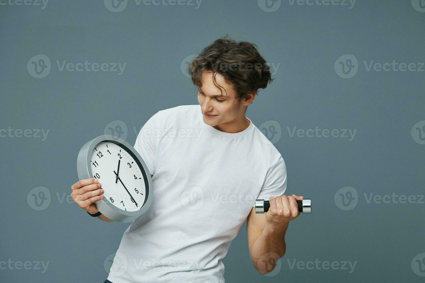 holding man dumbbell fitness fit clock sport lifestyle training exercise time photo