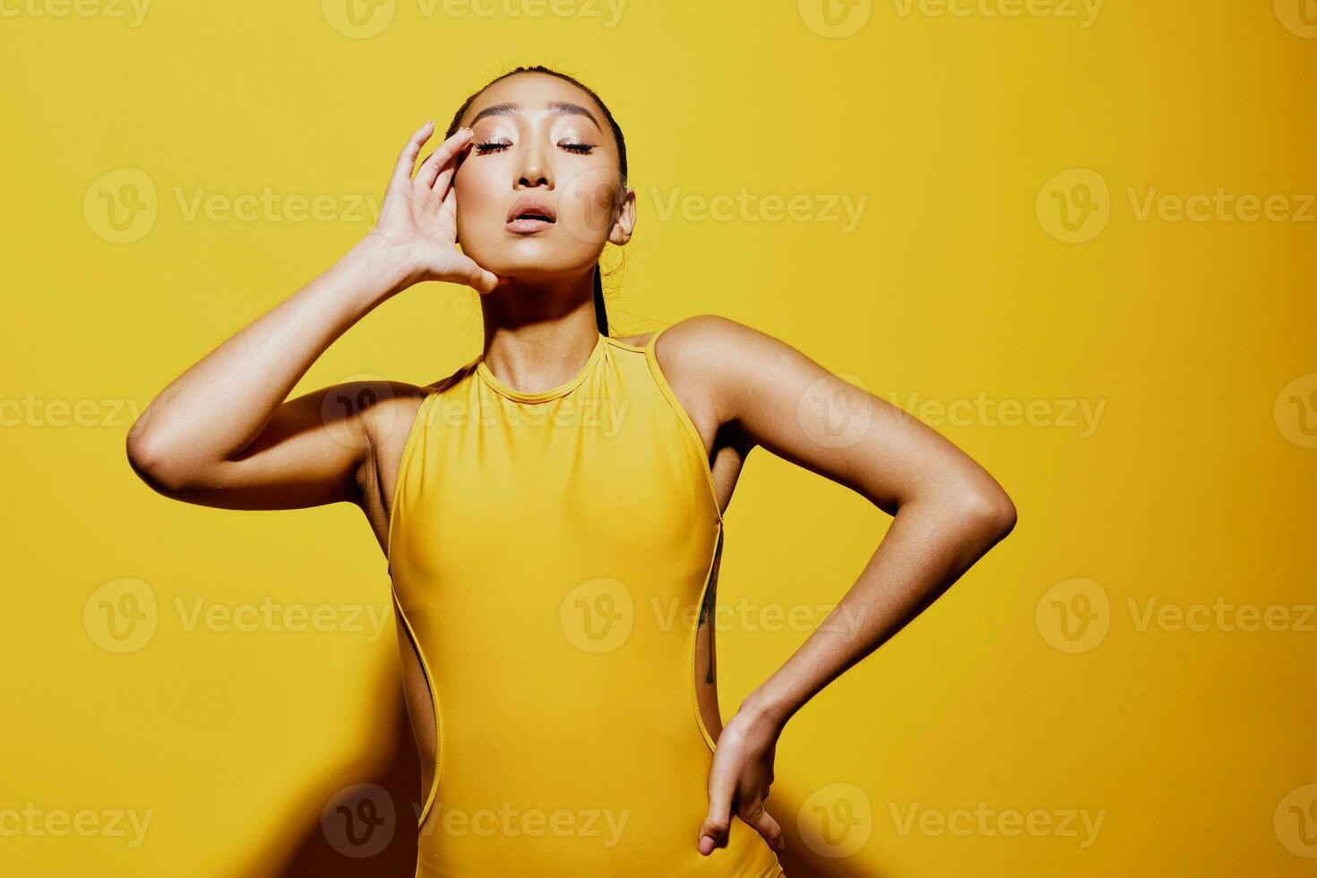 Young woman swimsuit surprised beauty summer fashion smile attractive portrait yellow lips emotion trendy photo