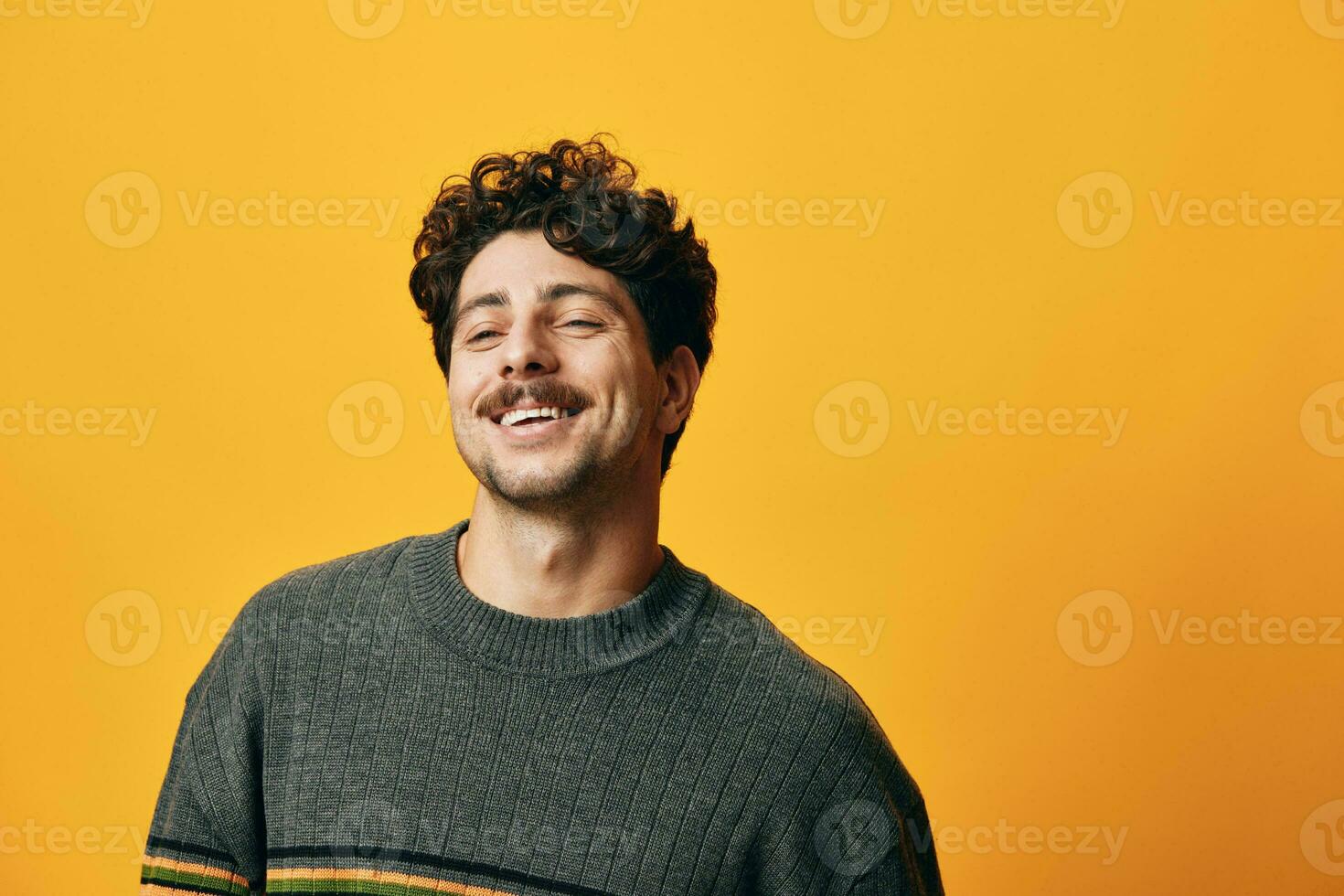 Caucasian man orange student background happy smile portrait trendy sweater fashion person photo