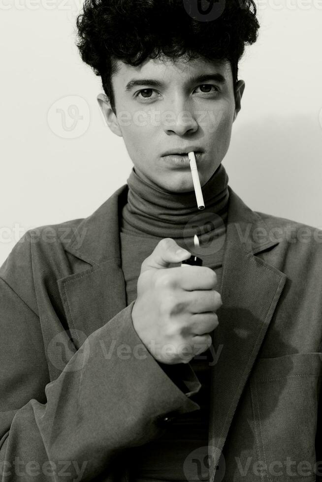 Man fashion black sitting white smoking and cigarette portrait photo