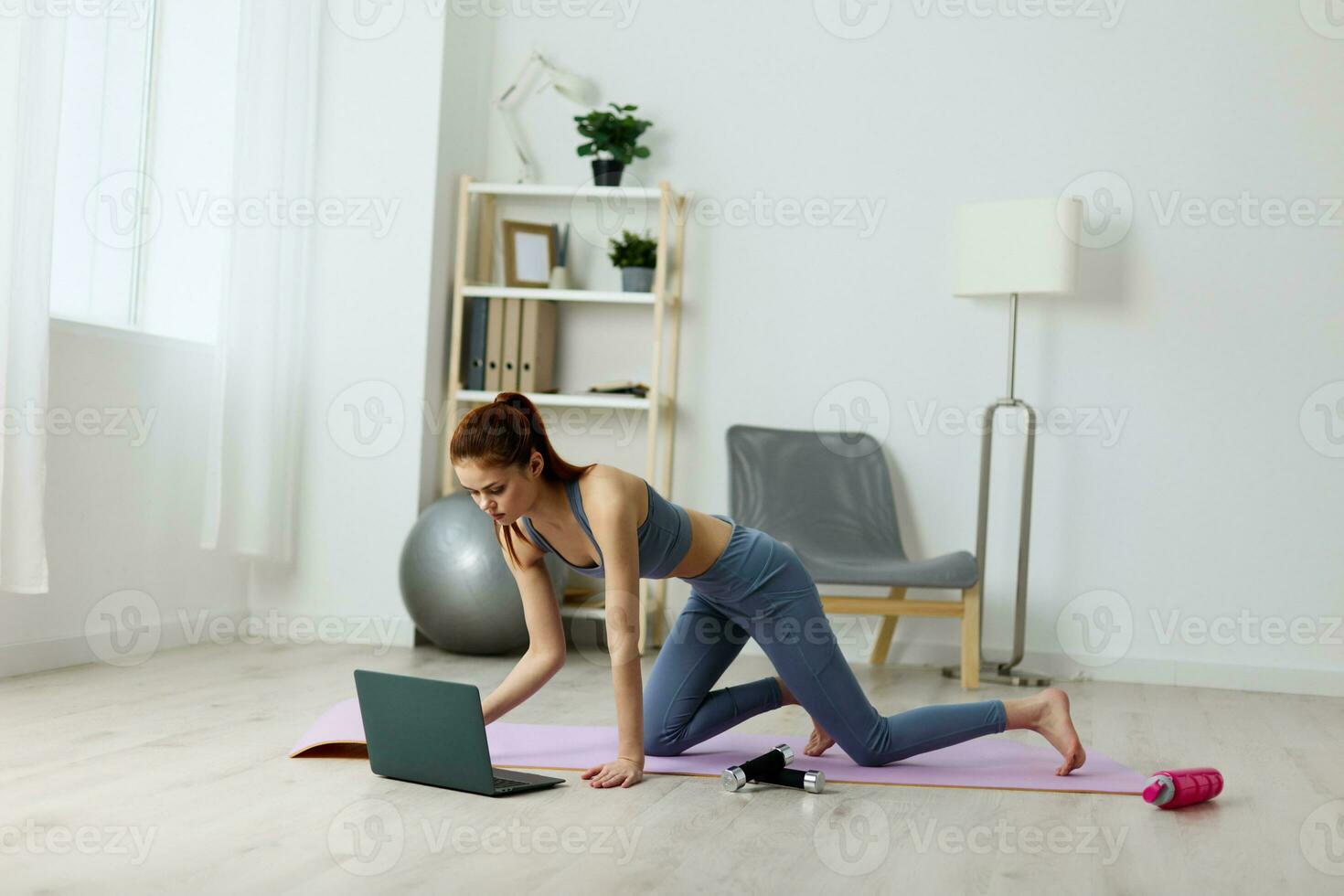 woman person laptop yoga mat training video home lifestyle health lotus photo