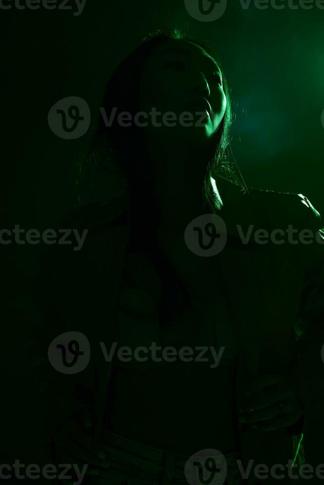 Portrait woman neon green trendy art light colourful concept purple smoke photo