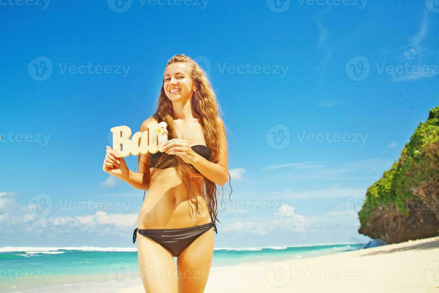 Beautiful woman on the beach photo