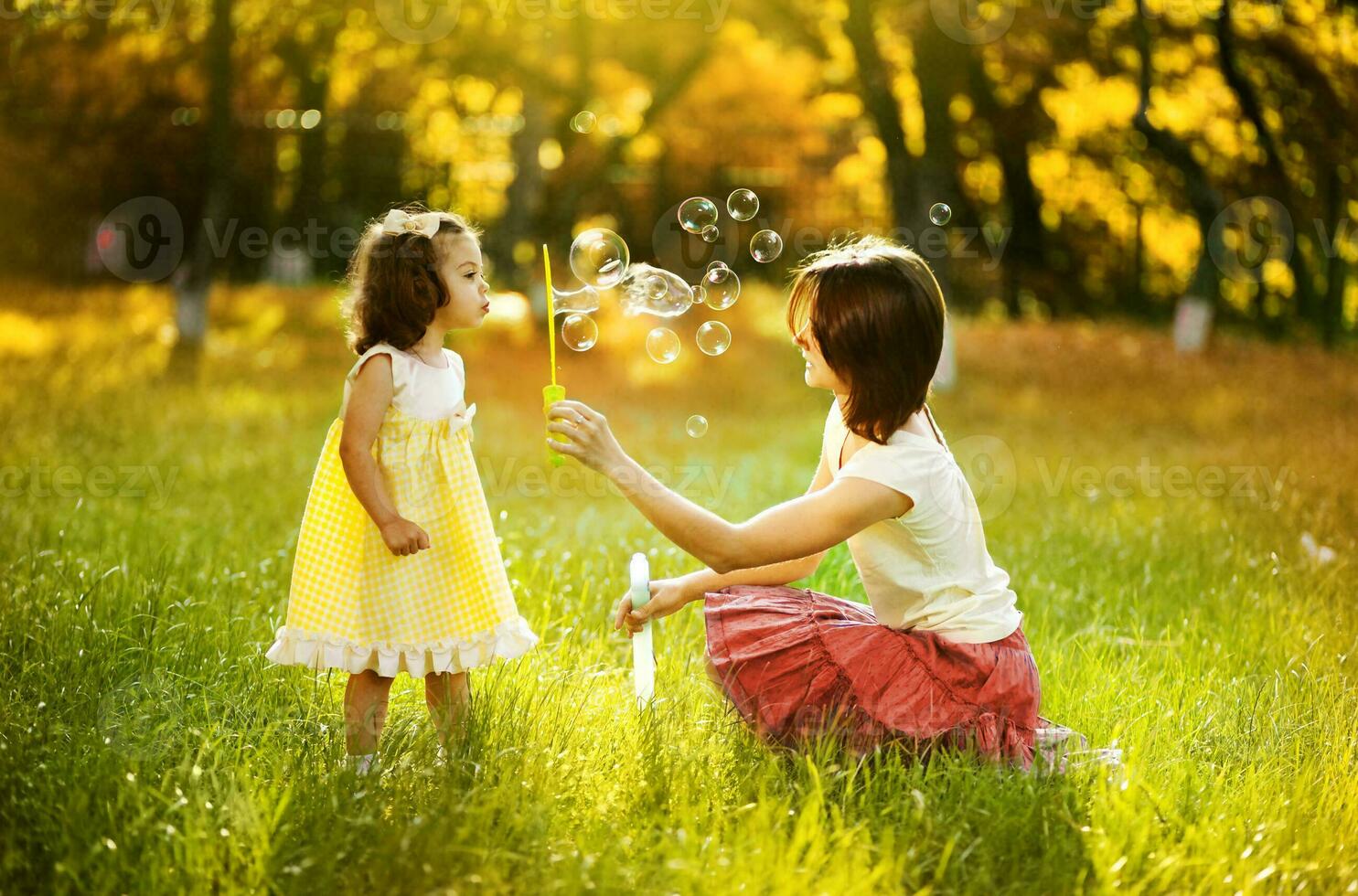 Mother and daughter in the park photo