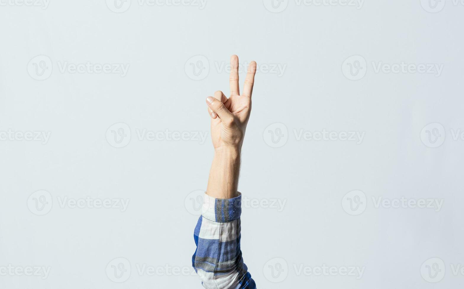 Counting the number TWO in sign language. Fingers counting the number TWO in sign language, Fingers of people counting the number TWO in sign language. Concept of numbers in sign language photo