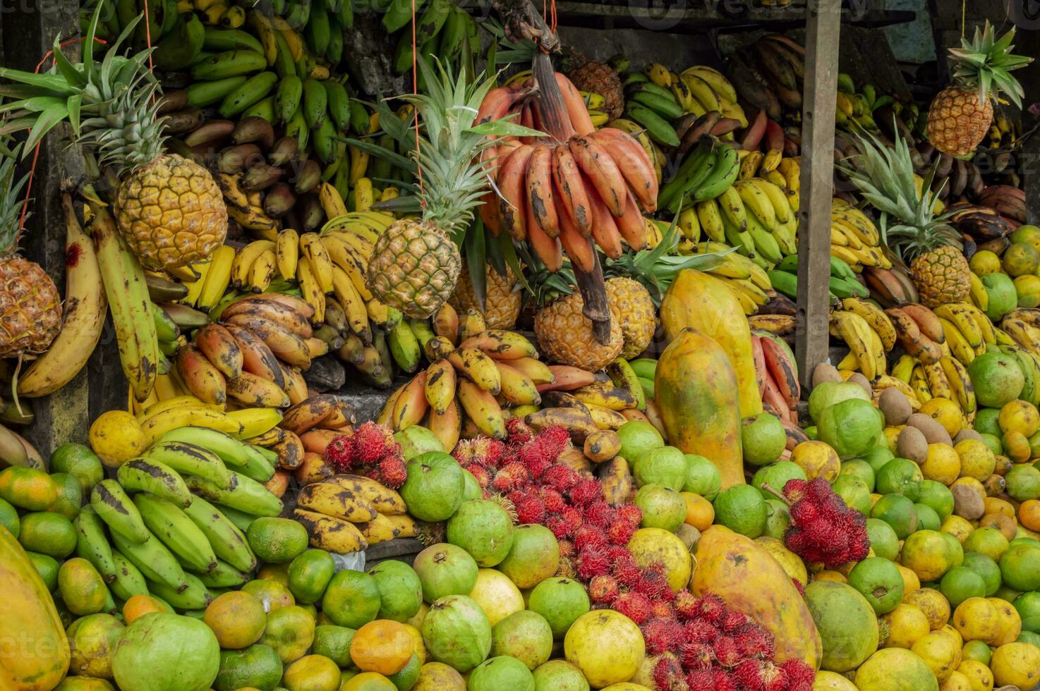 Shelf of many fresh fruits, fresh fruit stall, concept of fruits and healthy food, sale of various fruits photo