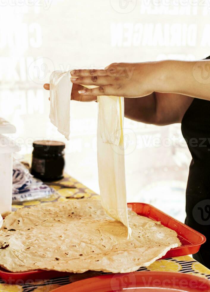 Preparation of traditional Nicaraguan cheese, Preparation of traditional Nicaraguan cheese. Nicaraguan cheese made and served. Traditional cheese with pickled onion. photo