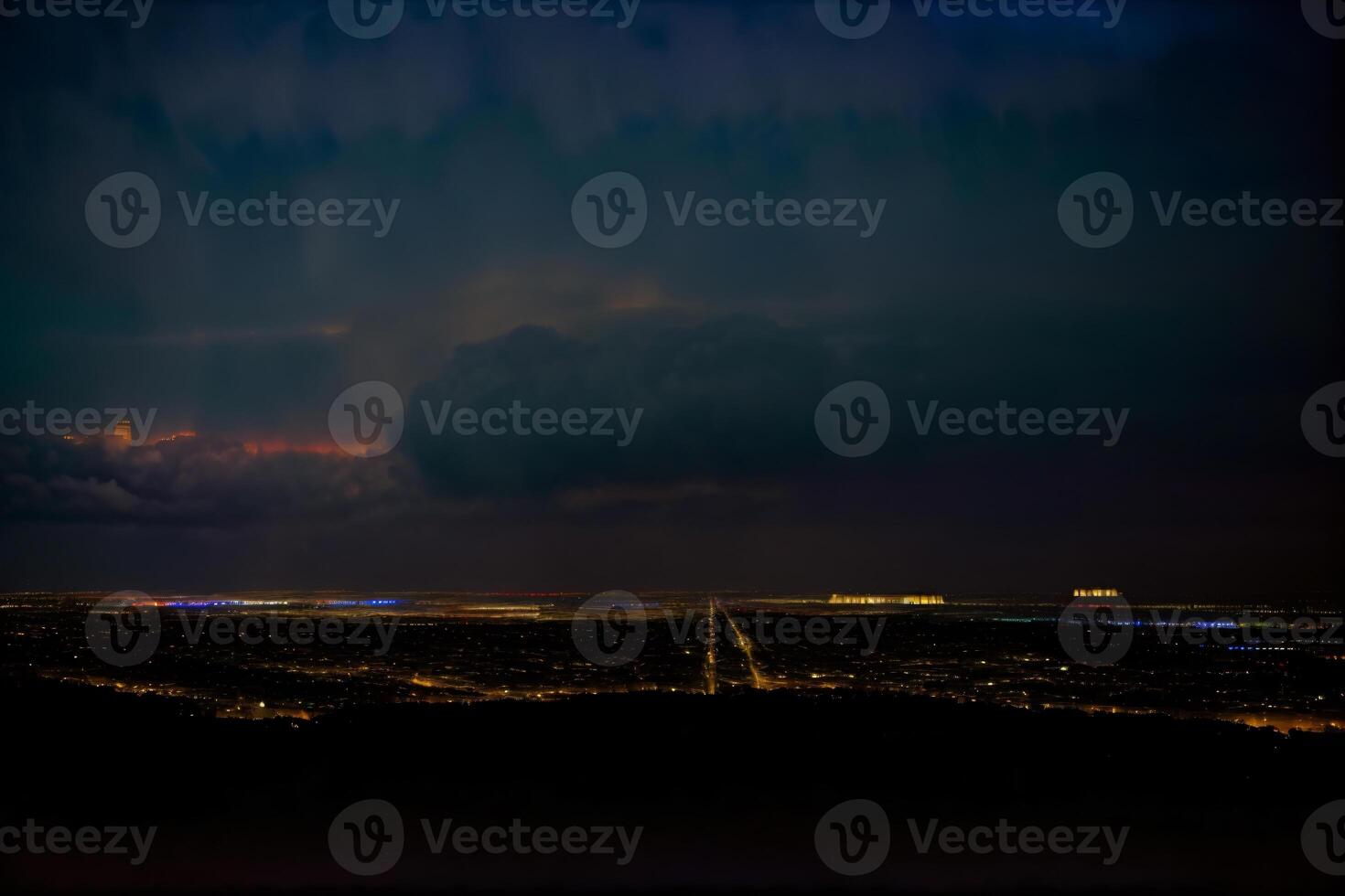 A View Of A City At Night From The Top Of A Hill. AI Generated photo