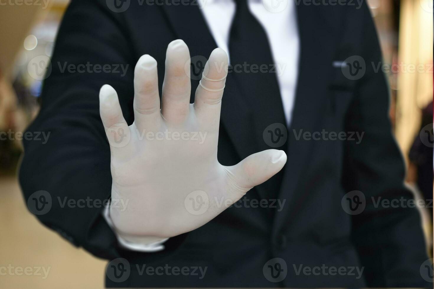 Close up of businessman wearing white latex gloves. Concept for protection health care from virus photo
