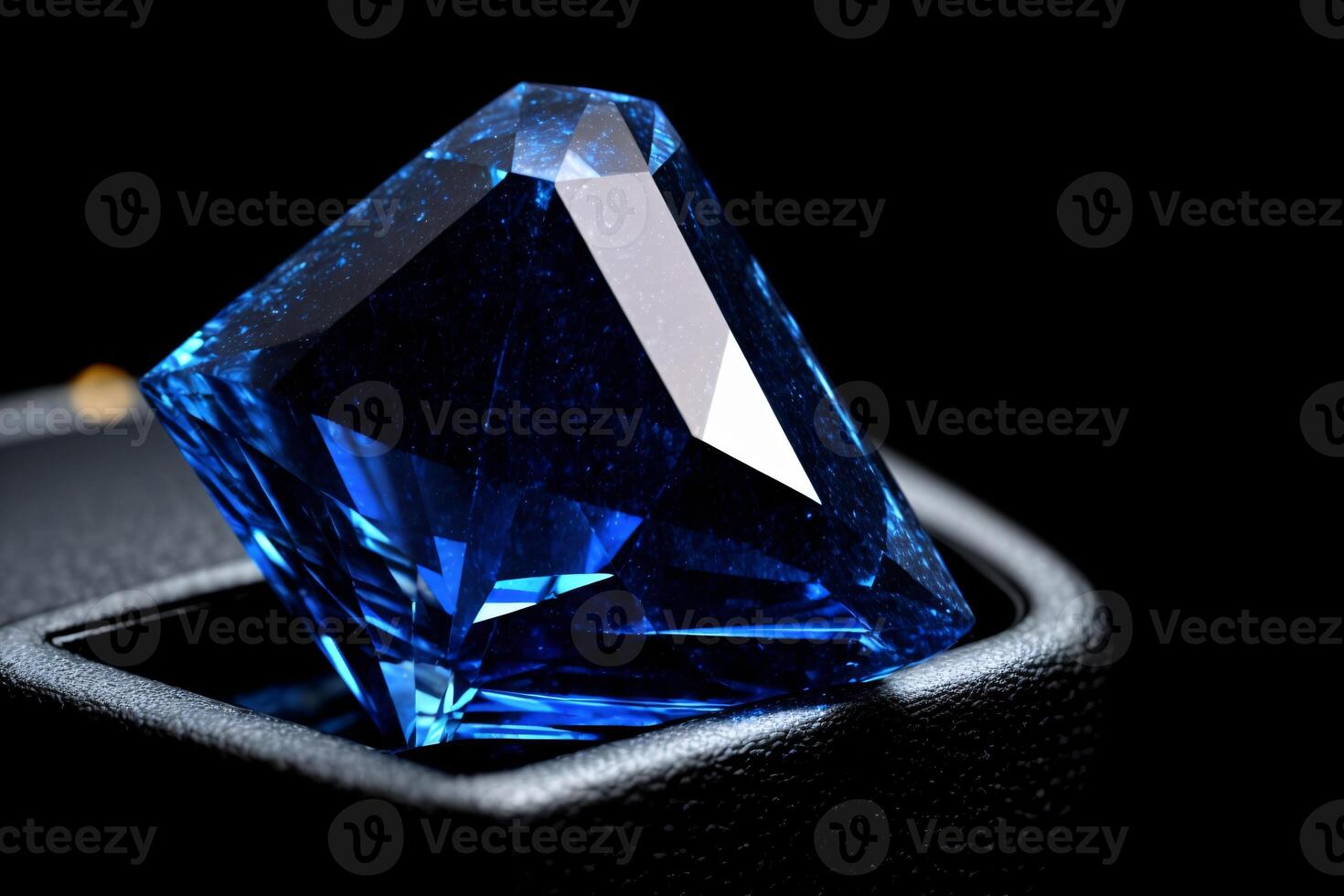 A Blue Diamond Sitting On Top Of A Table. photo
