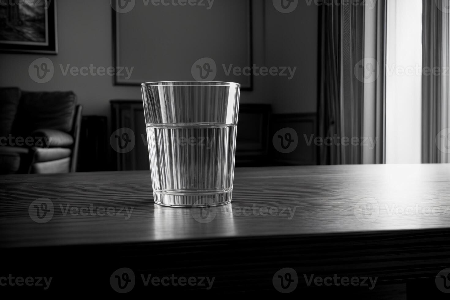 A Glass Sitting On Top Of A Wooden Table. photo