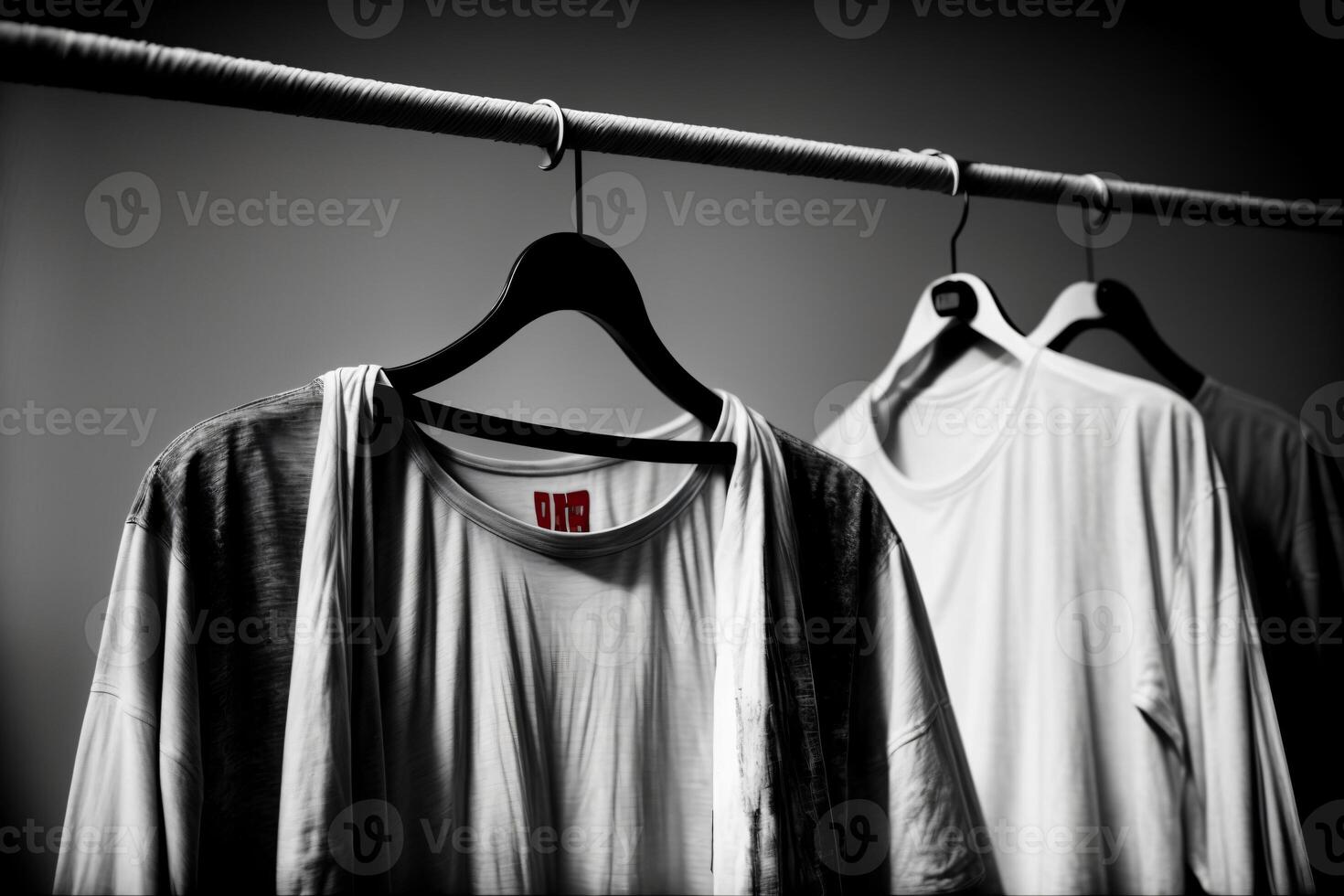A Couple Of Shirts Hanging On A Clothes Line. photo