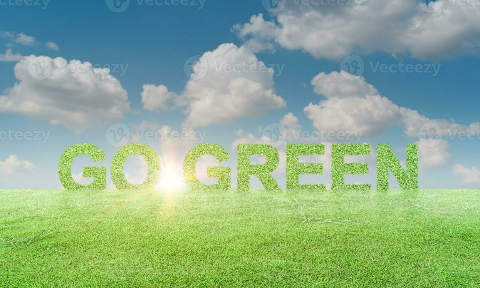 Go Green on grass field against blue sky background. ecology concept photo