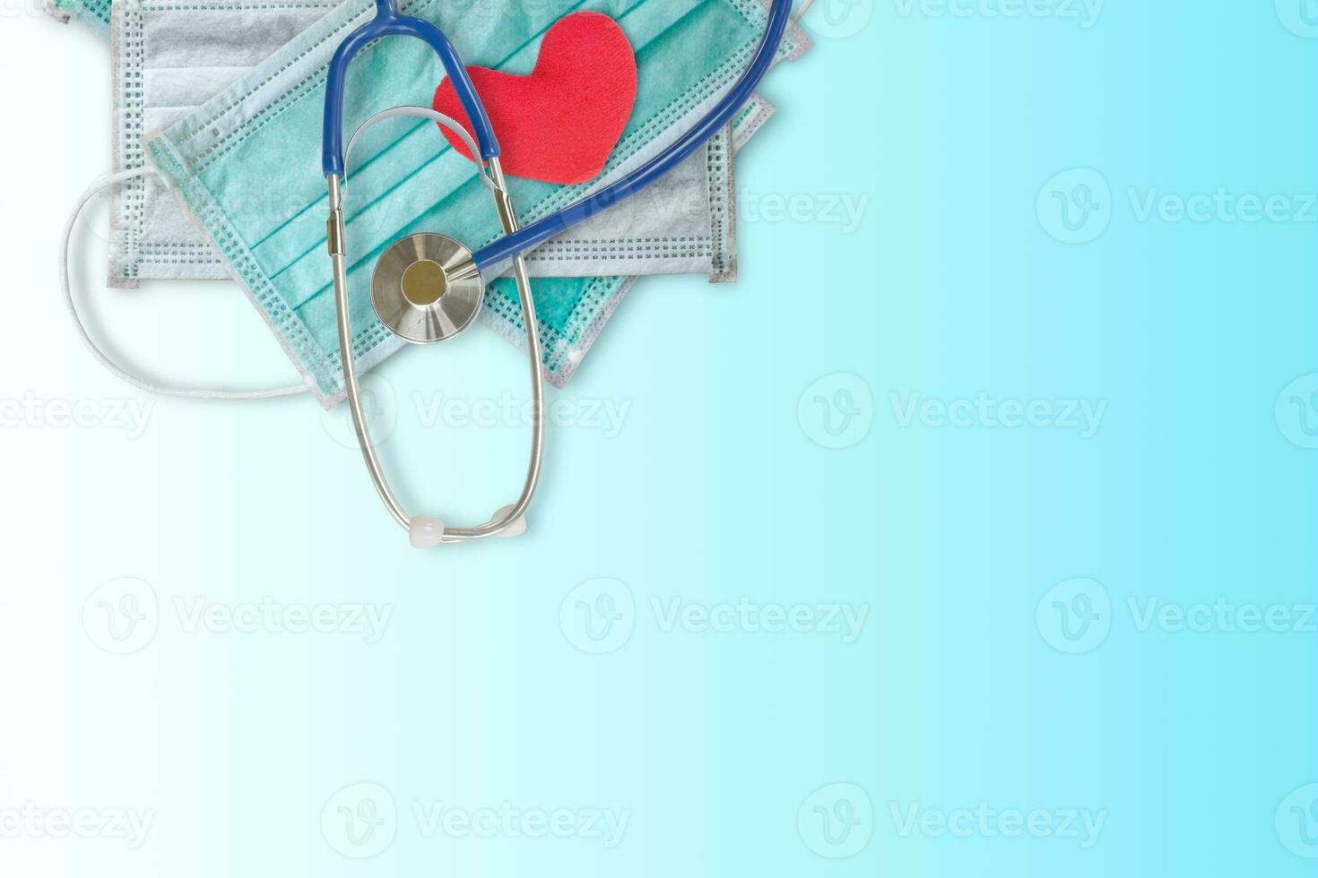 Medical mask and Stethoscope on gradient blue background with copy space for text. Protective of Coronavirus and Influenza photo