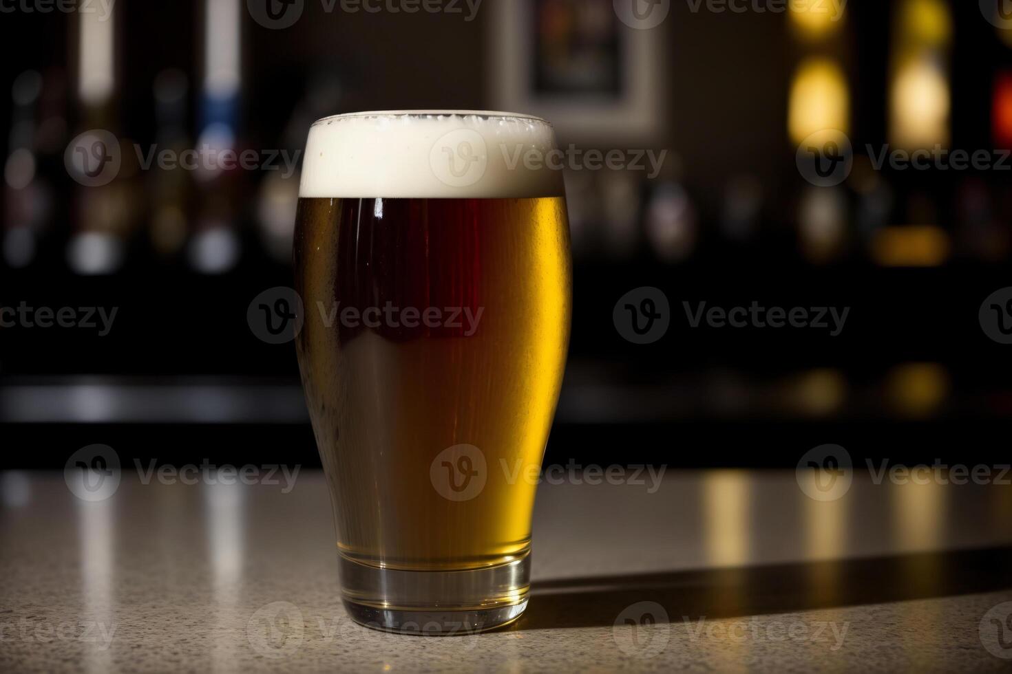 A Glass Of Beer Sitting On Top Of A Table. photo