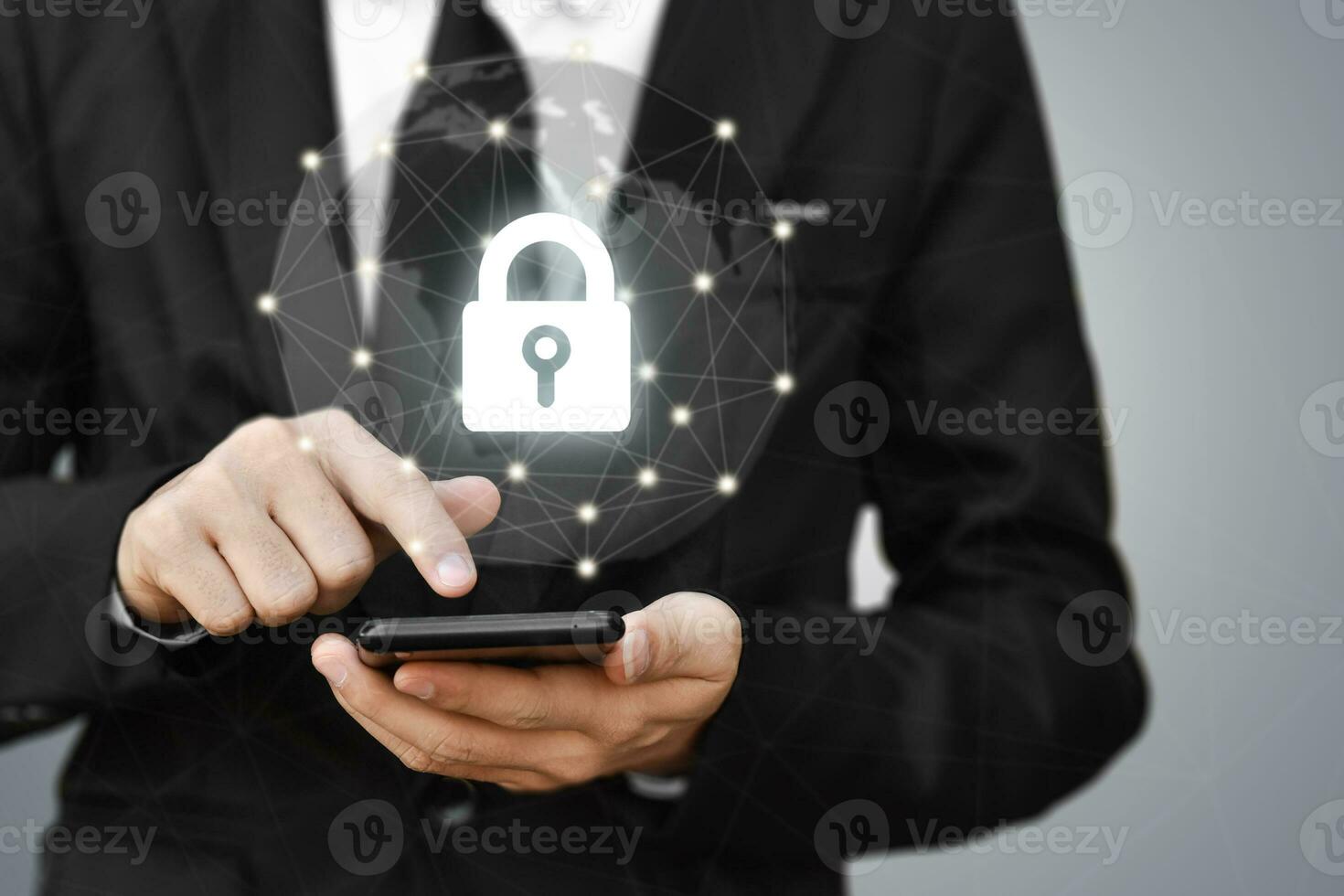 Businessman holding mobile phone with shield lock. Cyber security data protection and information technology network concept. photo