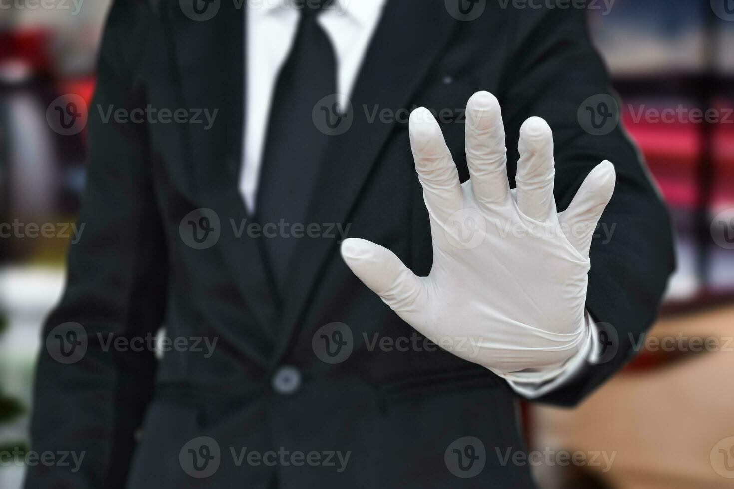 Close up of businessman wearing white latex gloves. Concept for protection health care from virus photo