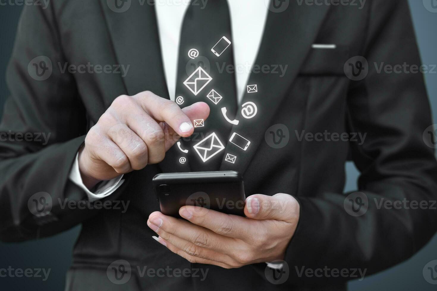 Businessman hand holding smartphone with icon mobile phone, email address, and like. Concept of using social media. copy space. photo
