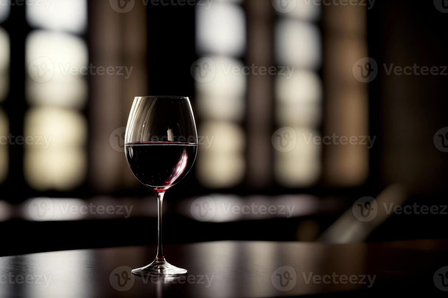 A Glass Of Wine Sitting On Top Of A Table. photo