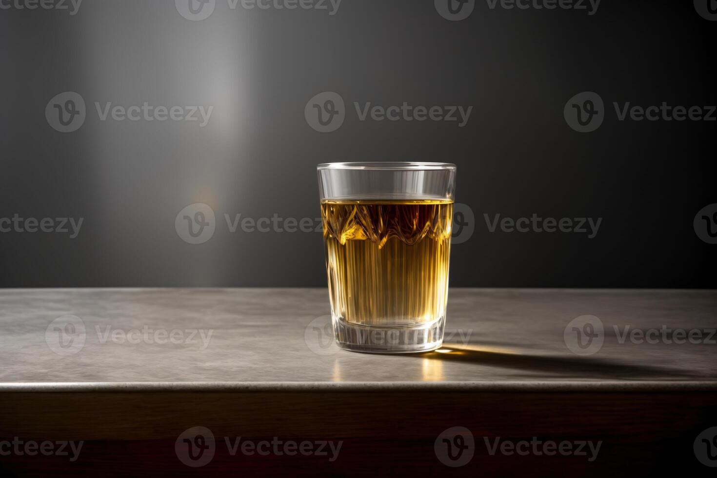 A Glass Filled With Liquid Sitting On Top Of A Table. photo