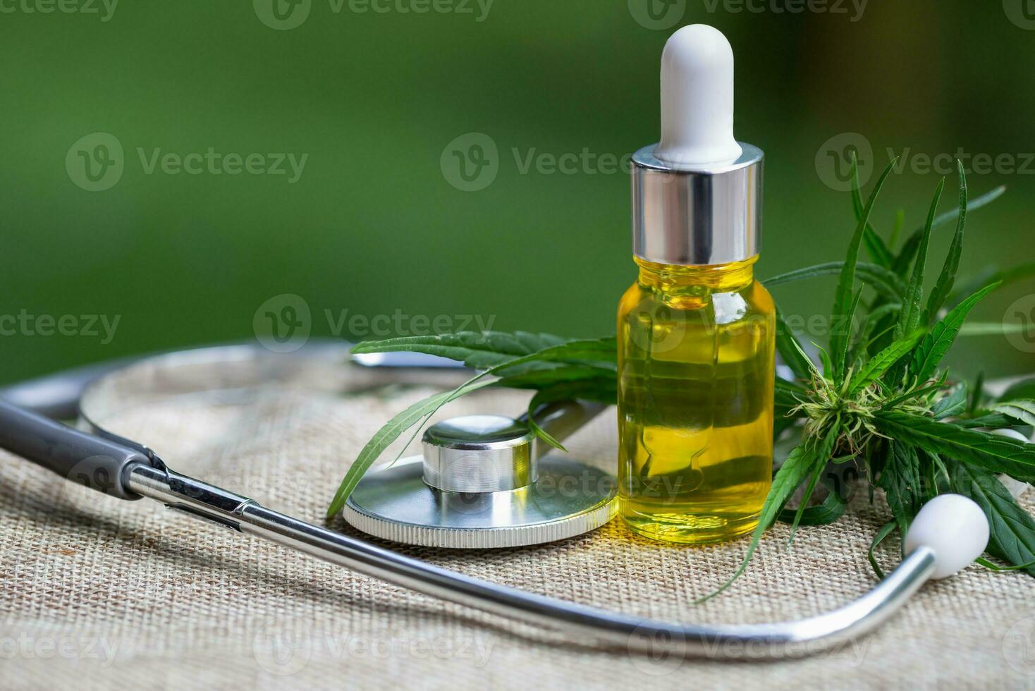 CBD oil cannabis extract, Hemp oil bottles and hemp flowers on a wooden table,  Medical cannabis concept, copy space. photo