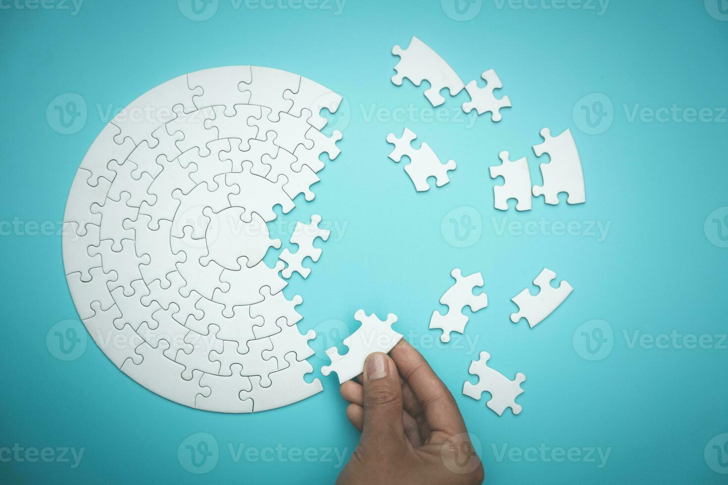 Pieces of jigsaw puzzle in man's hands, Business solutions, success and strategy concept. photo