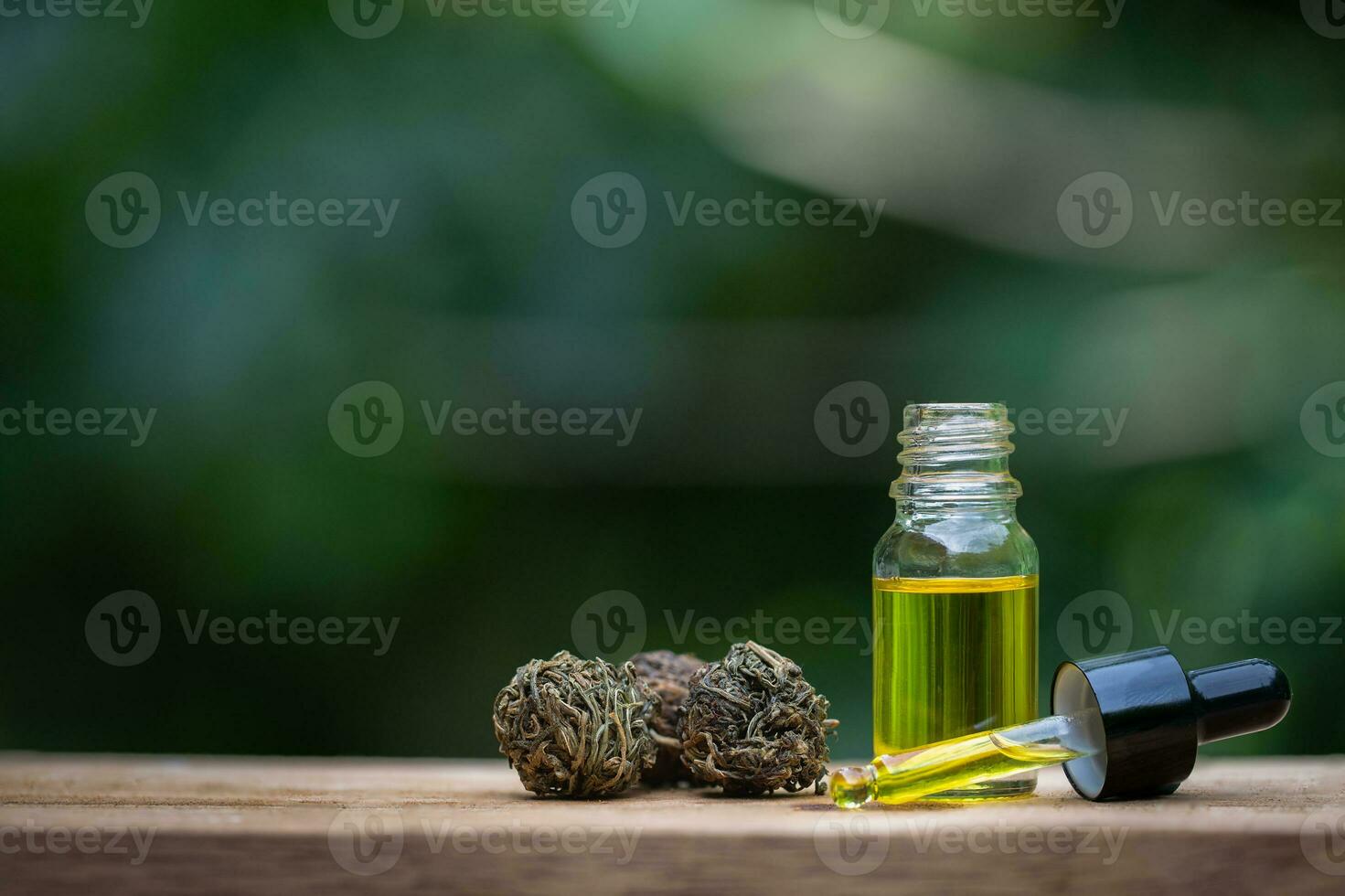 CBD oil hemp products, cannabis extract oil on a wooden table, Medical marijuana. photo