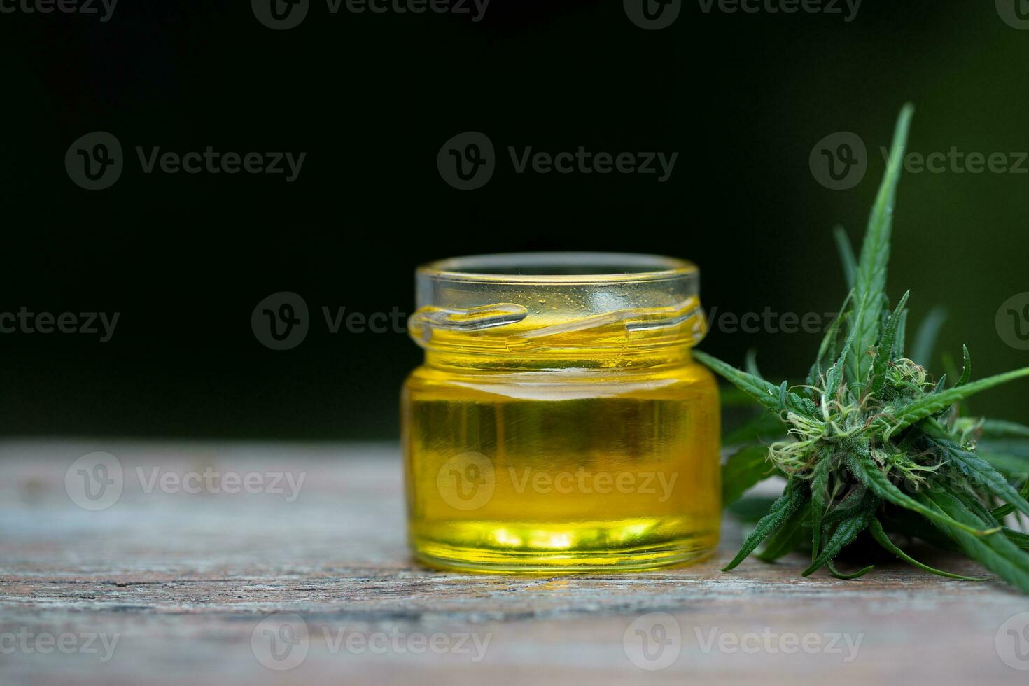 Hemp oil in a glass jar, CBD cannabis oil.Alternative herbs for medicine. copy space. photo