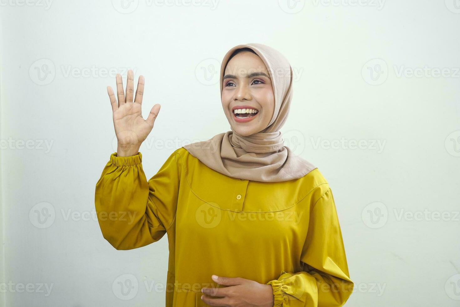 Excited Asian woman wearing a casual dress giving number 12345 by hand gesture photo