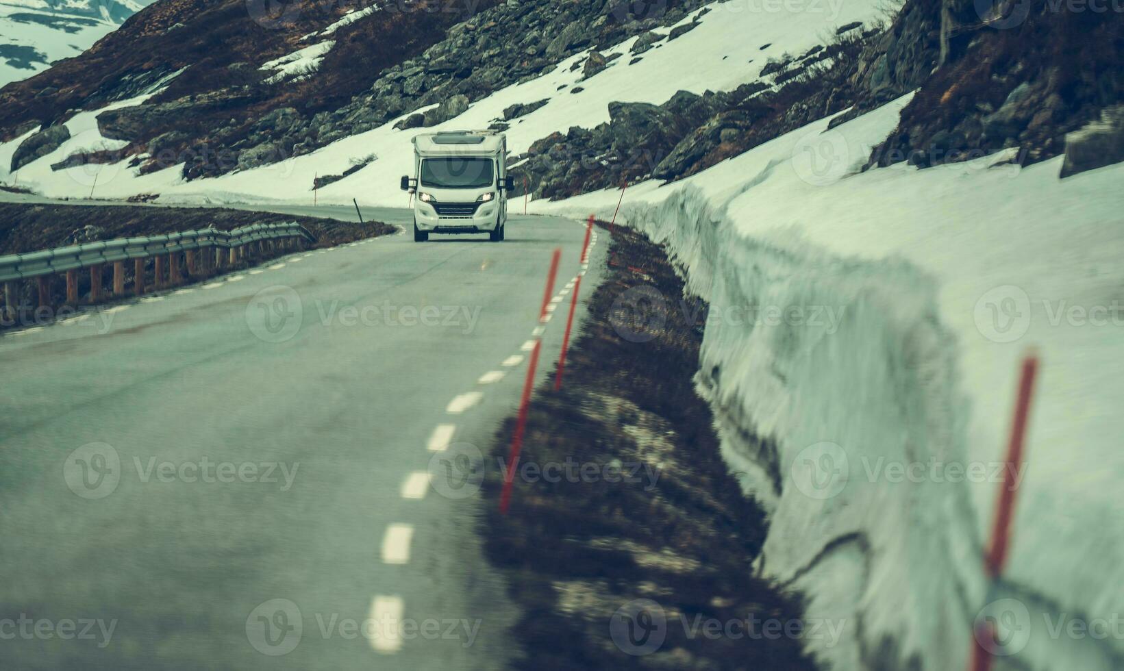 White RV Driving Down the Road photo