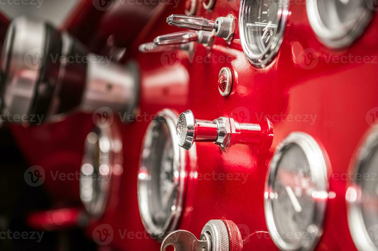Classic Car Elegant Red Dashboard with Chromed Switches and Indicators photo