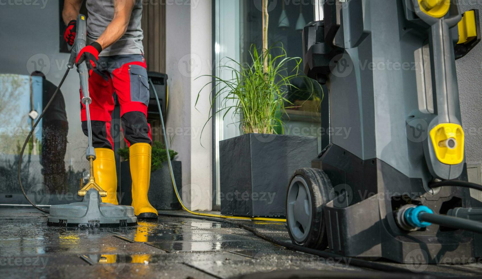 Patio Concrete Bricks Surface Cleaning Using Powerful Pressure Washer photo