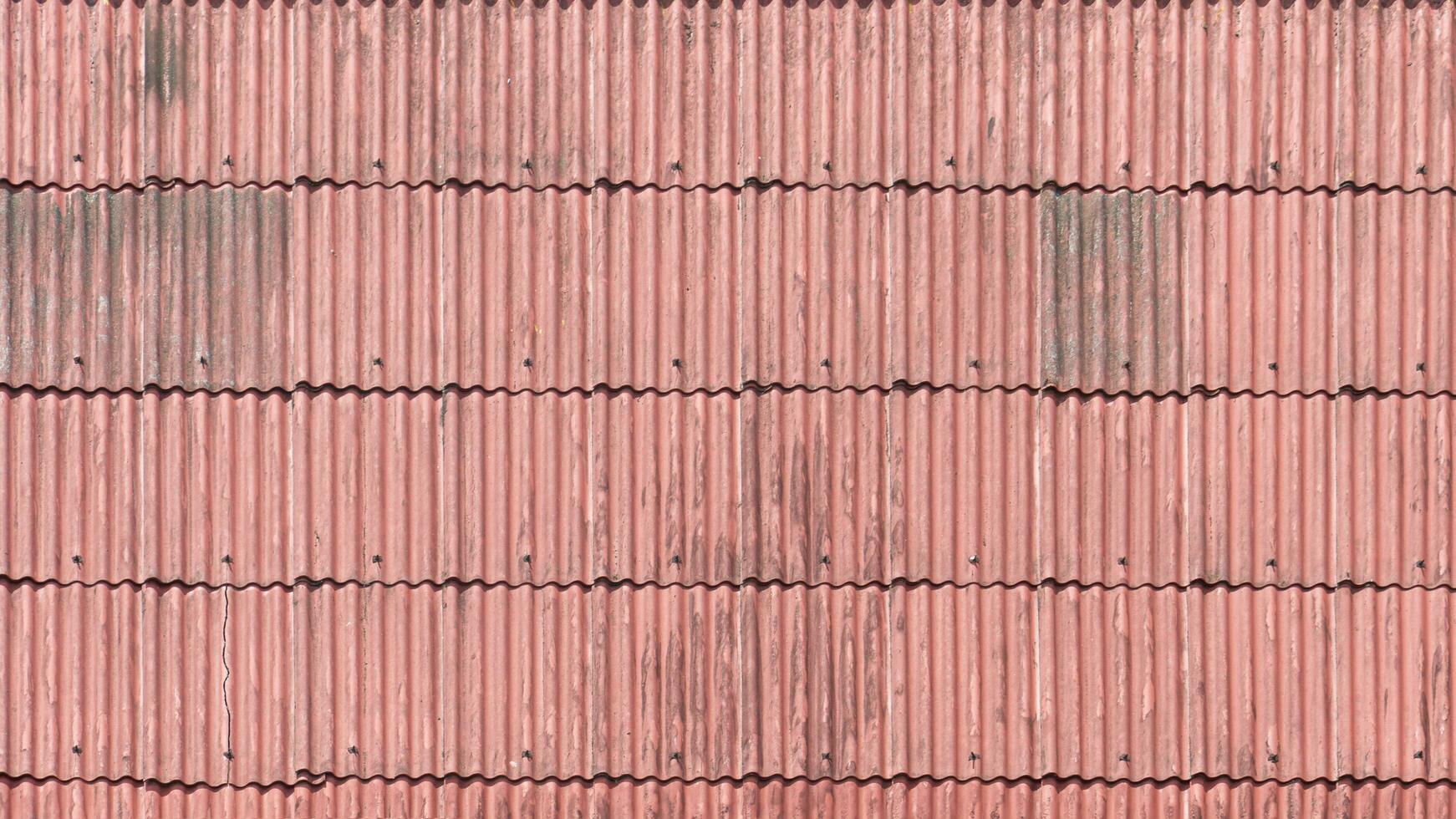 Above view old and used of red roof. Contruction of home for background and textured. photo