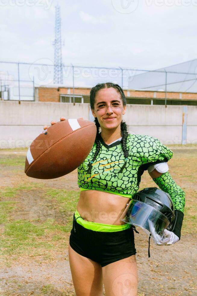 Portrait of mexican woman american football player wearing uniform with velociraptor skin patterns photo