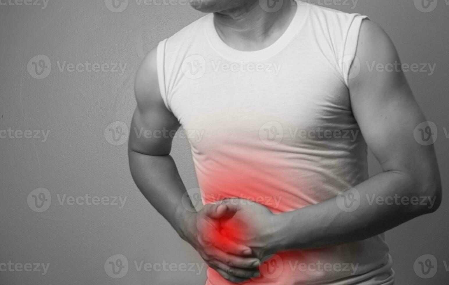 Abdominal Pain  Man suffering from stomach ache. He holds his stomach and has hurt. on white background photo