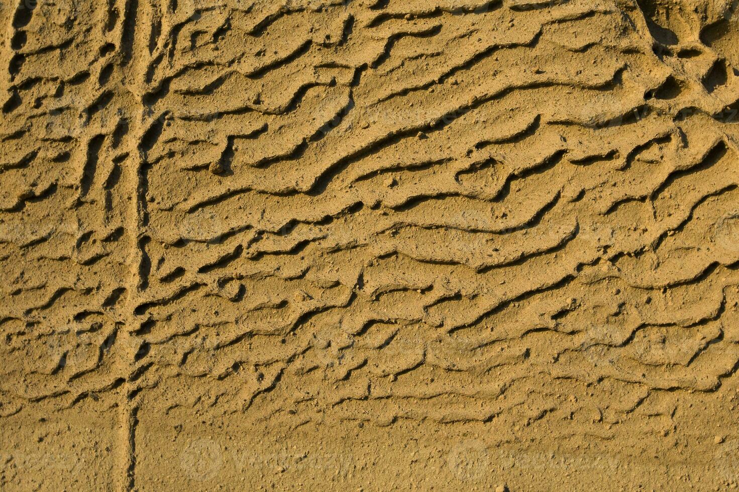 Closeup of Vlychada beach volcanic ash sand rock formation on Santorini island in Greece photo