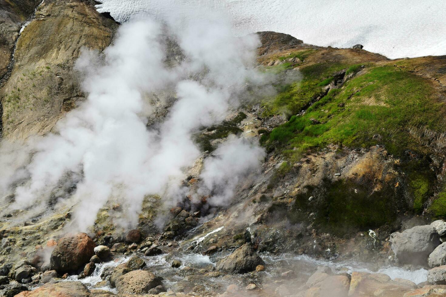 Volcanoes. Fumarole field. snow volcanoes in Kamchatka, snow mountains as geysers photo