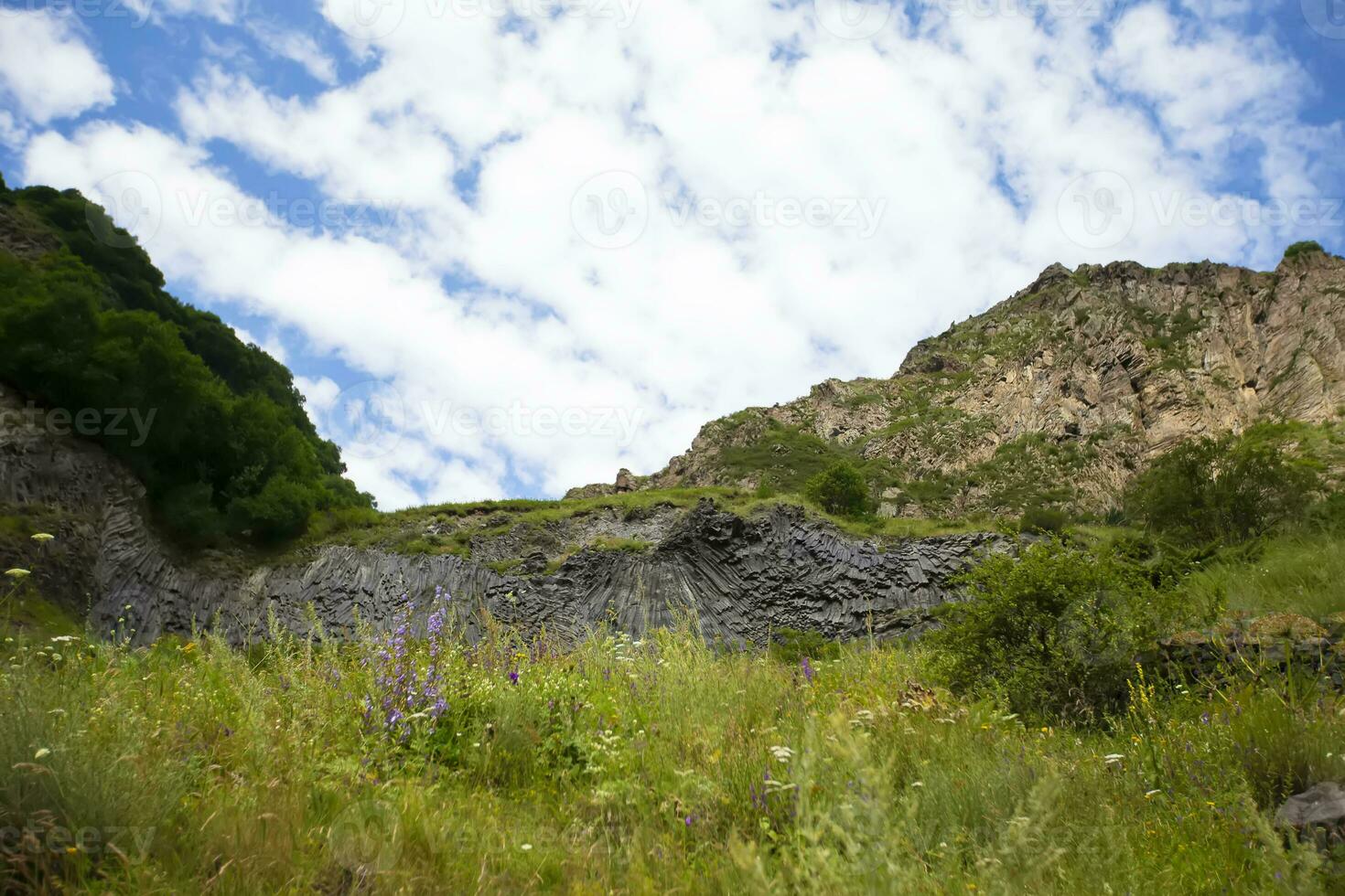 Mountain landscape. Beautiful mountains and meadows against the blue sky. photo