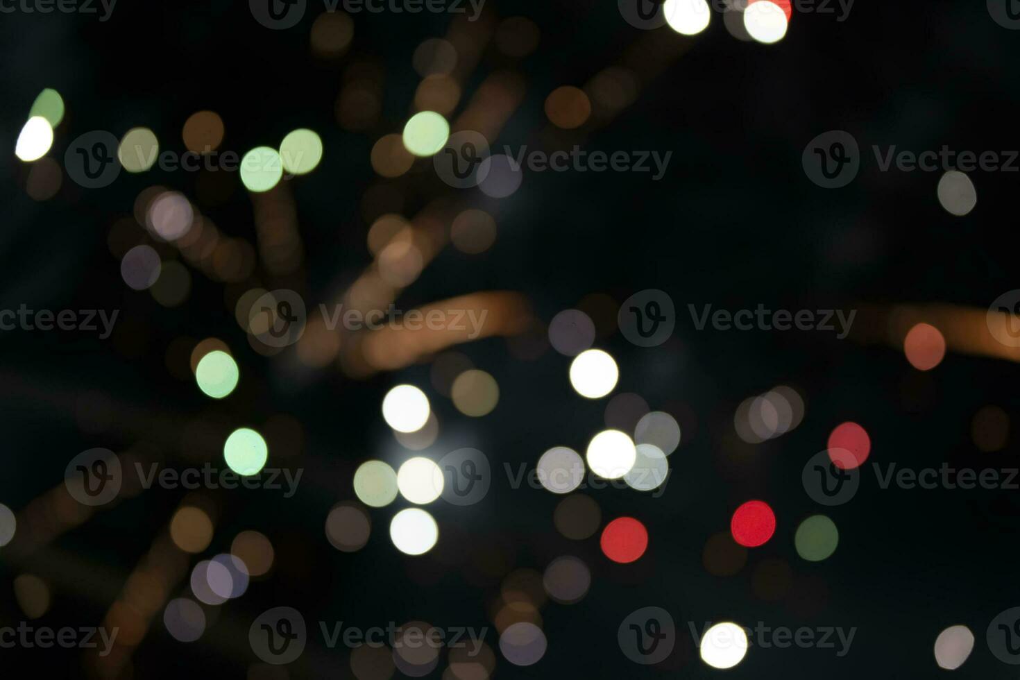 On a black background bokeh from explosions of colorful fireworks. photo
