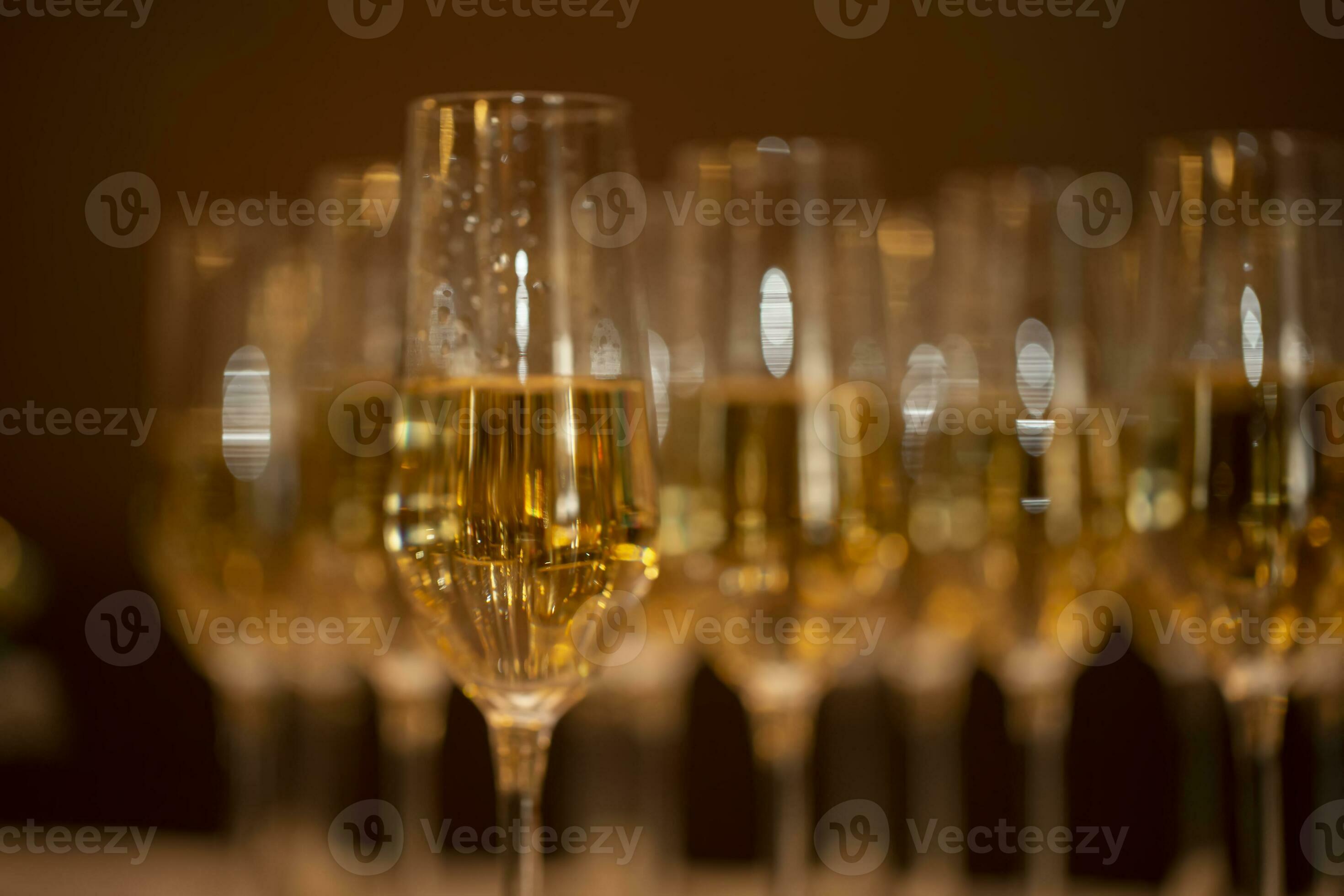 A row of beautiful champagne glasses with bokeh and blur. 26455988