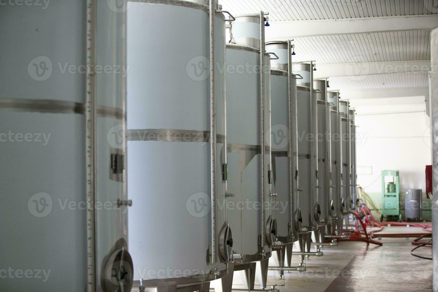 Industrial metal tanks for wine at a plant for the production of alcoholic beverages. photo