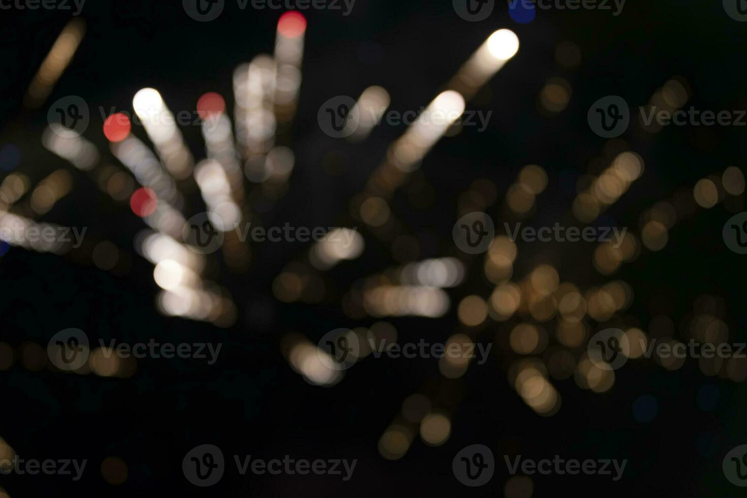 On a black background bokeh from explosions of colorful fireworks. photo