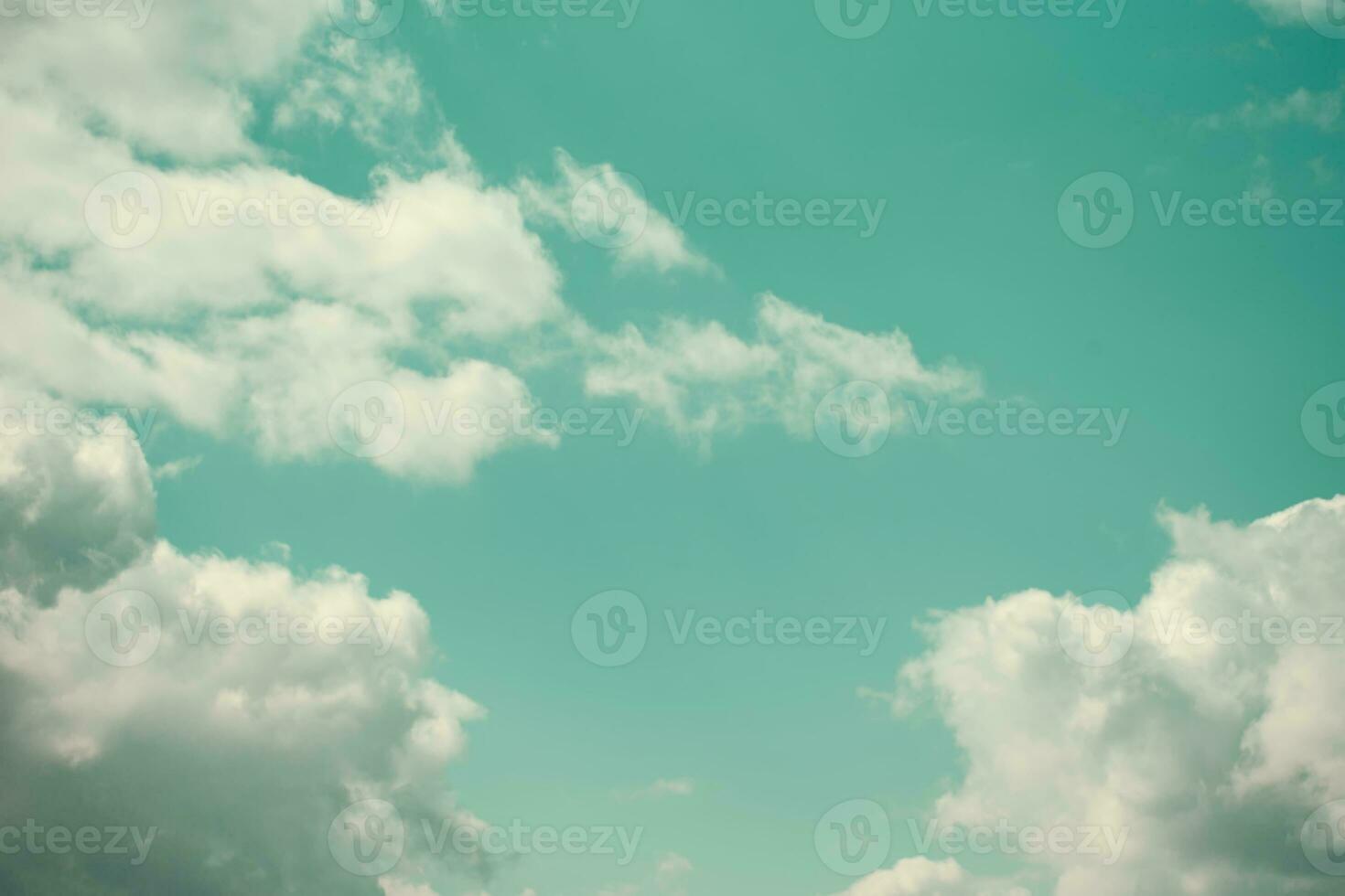 Vintage sky in emerald tones and clouds. Romantic old heavenly background. photo