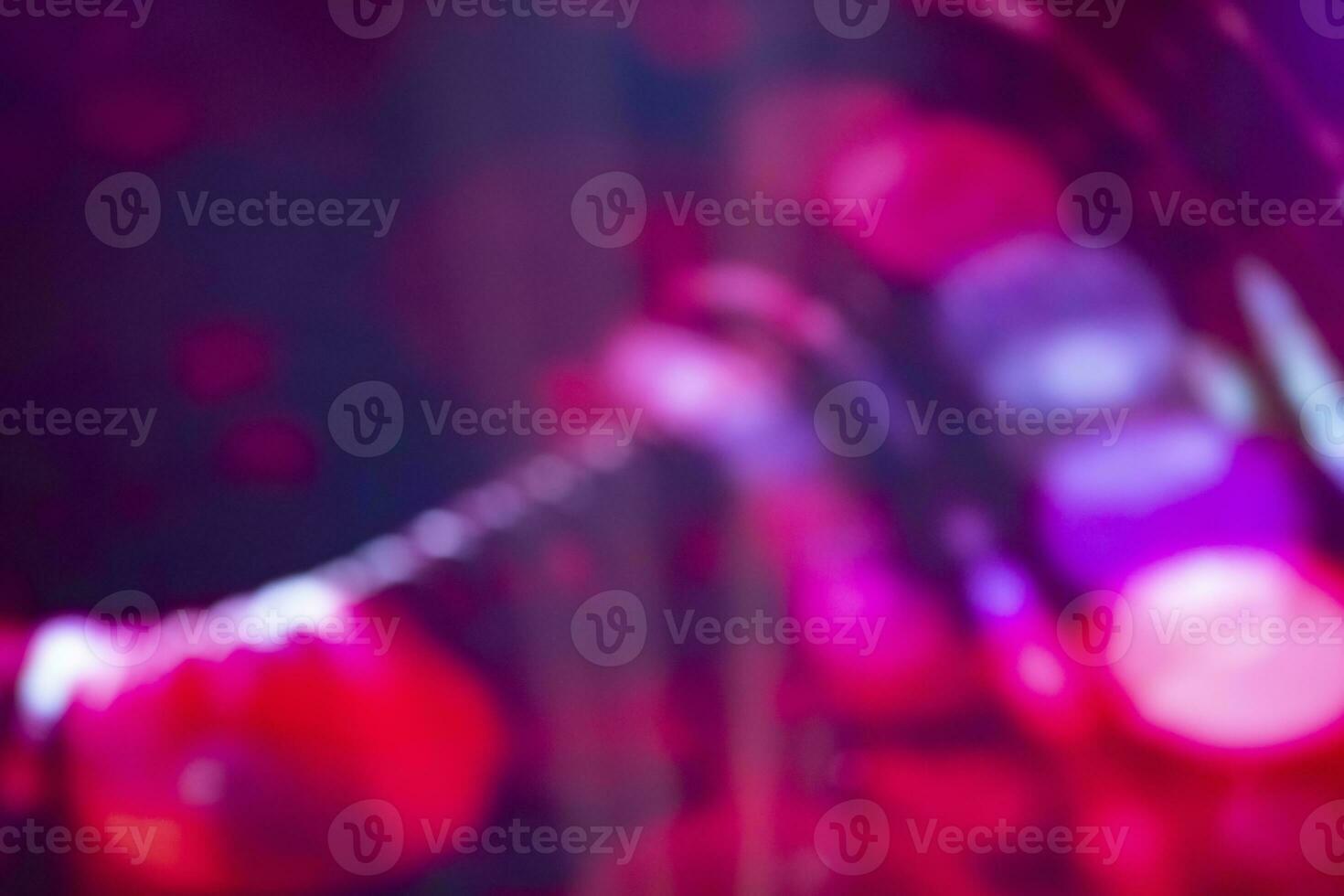 Violet-pink blurred background with bokeh spots. photo