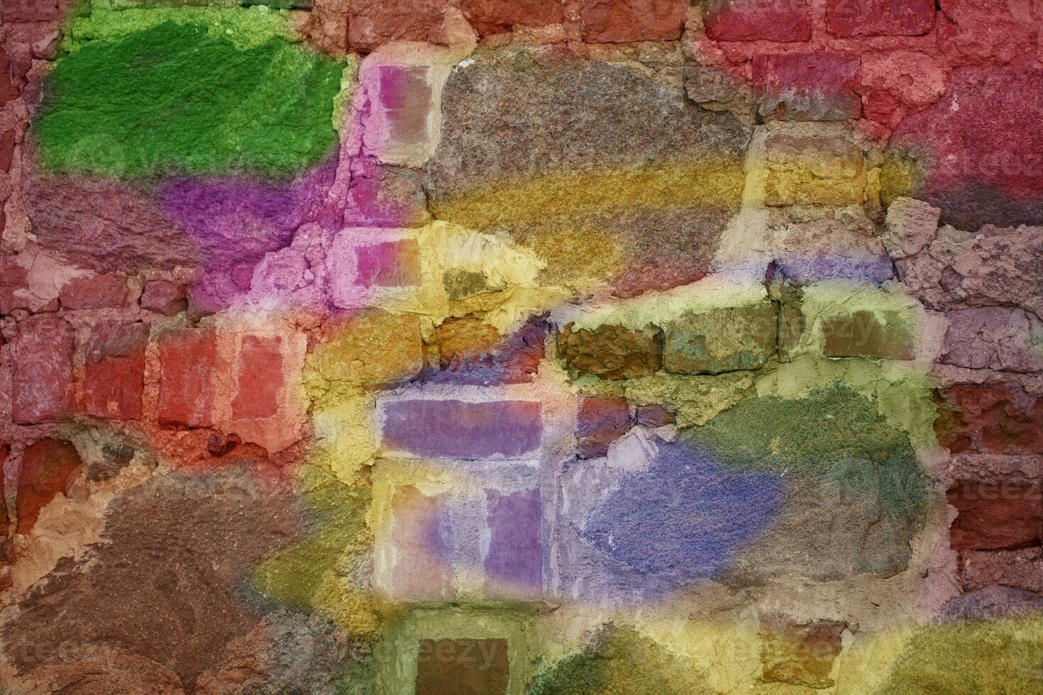 Brick wall with multi-colored paint close-up. Background brick creative. photo