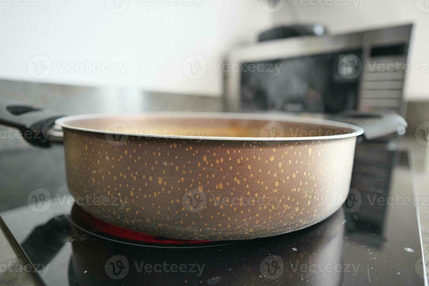 cooking pan on electric stove, electric stove is heated to red. photo