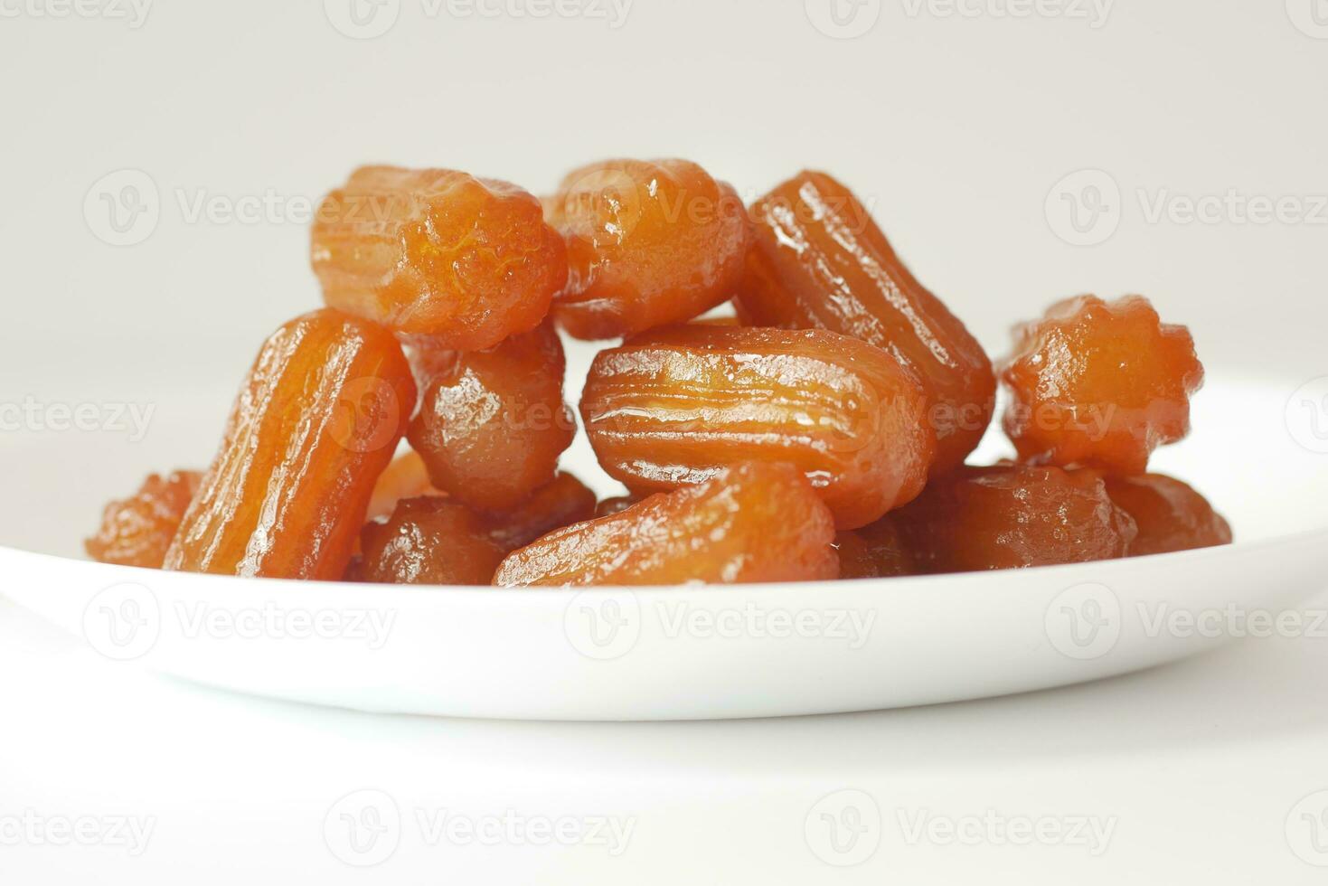 Traditional Turkish dessert tulumba on a plate photo