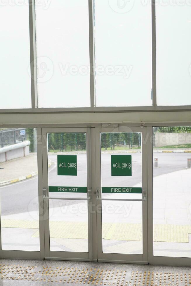 exit sign on brick wall photo